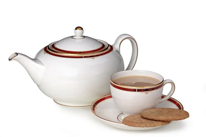 Gerahmter Druck : Teekanne, Tasse und Biscuits