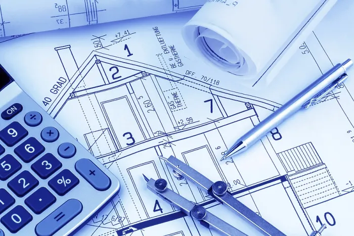 Gerahmter Druck : Ein Architektenbauplan mit einem Taschenrechner. Gerahmter Druck : Ein Architektenbauplan mit einem Taschenrechner.