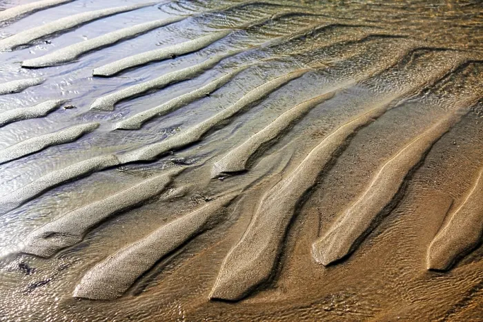 Gerahmter Druck : Hintergrund eines gewellten Sandstrandes. Gerahmter Druck : Hintergrund eines gewellten Sandstrandes.