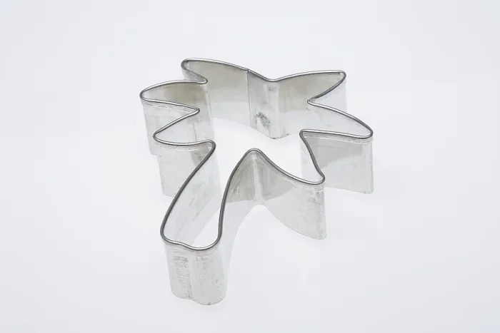 Gerahmter Druck : Backformen in Form einer Palme. Gerahmter Druck : Backformen in Form einer Palme.