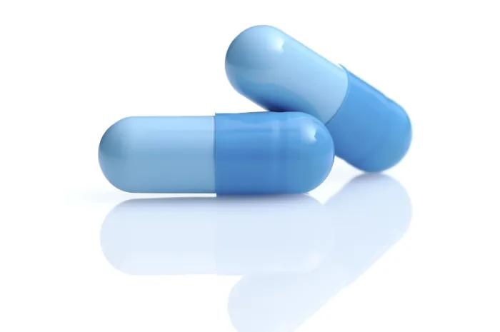 Gerahmter Druck : Zwei blaue Kapseln. Gerahmter Druck : Zwei blaue Kapseln.