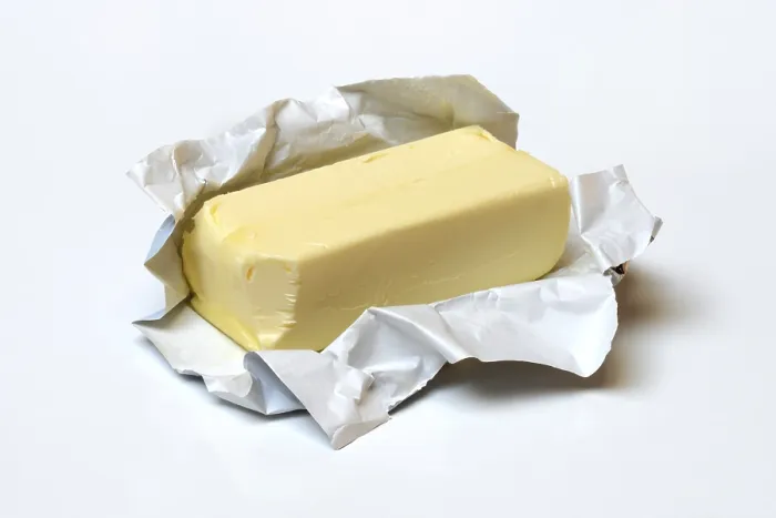 Gerahmter Druck : Butter mit geöffnetem Verpackung. Gerahmter Druck : Butter mit geöffnetem Verpackung.