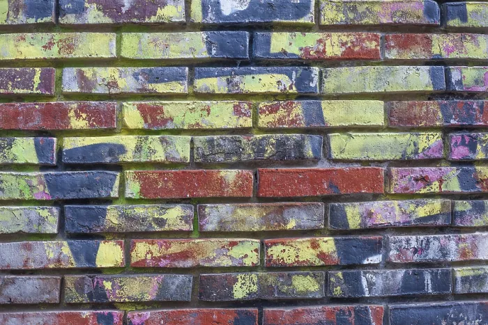 Gerahmter Druck : Farbig bemalte Backsteinmauer. Gerahmter Druck : Farbig bemalte Backsteinmauer.