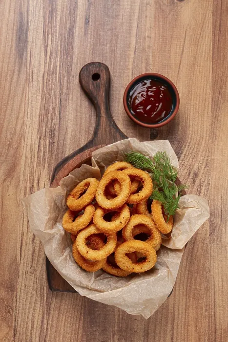 Gerahmter Druck : Pommesringe in frittierter Form, Vorspeise. Gerahmter Druck : Pommesringe in frittierter Form, Vorspeise.