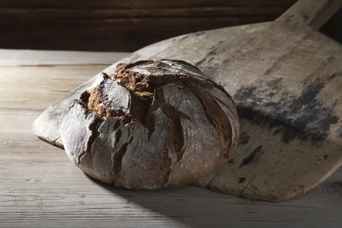 Gerahmter Druck : Brot aus dem alten Backofen. Gerahmter Druck : Brot aus dem alten Backofen.