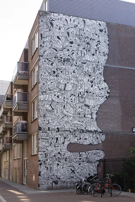 Gerahmter Druck : Graffiti auf Hausfassade in Form eines Gesichts. Gerahmter Druck : Graffiti auf Hausfassade in Form eines Gesichts.