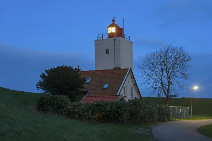 Gerahmter Druck : Der in der Liste stehende Leuchtturm De Ven am Abend. Gerahmter Druck : Der in der Liste stehende Leuchtturm De Ven am Abend.