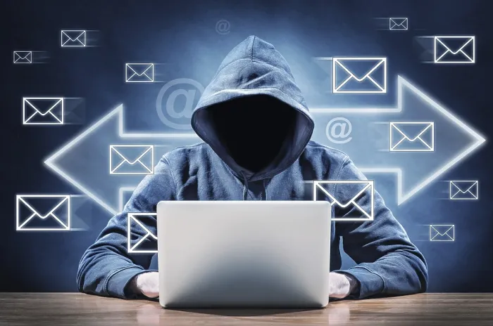 Gerahmter Druck : Ein Mann auf einem Computer sendet Spam-E-Mails. Gerahmter Druck : Ein Mann auf einem Computer sendet Spam-E-Mails.
