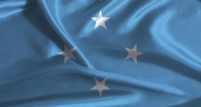 Gerahmter Druck : Flagge von Mikronesien mit gestricktem Stoffhintergrund. Gerahmter Druck : Flagge von Mikronesien mit gestricktem Stoffhintergrund.