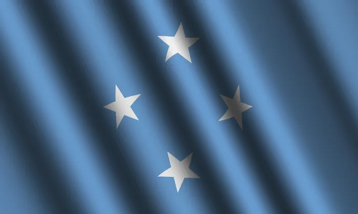 Gerahmter Druck : Die Flagge von Mikronesien weht im Wind. Gerahmter Druck : Die Flagge von Mikronesien weht im Wind.