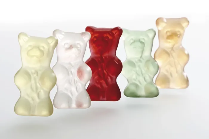 Gerahmter Druck : Bunte Gummibärchen, hintereinander. Gerahmter Druck : Bunte Gummibärchen, hintereinander.