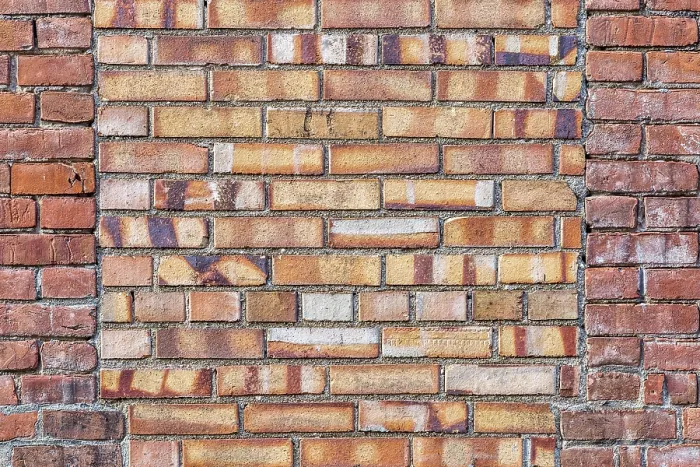 Gerahmter Druck : Alte Ziegelmauer-Hintergrundtextur mit einem Fenster, das von verschiedenen Ziegeln bedeckt ist. Gerahmter Druck : Alte Ziegelmauer-Hintergrundtextur mit einem Fenster, das von verschiedenen Ziegeln bedeckt ist.