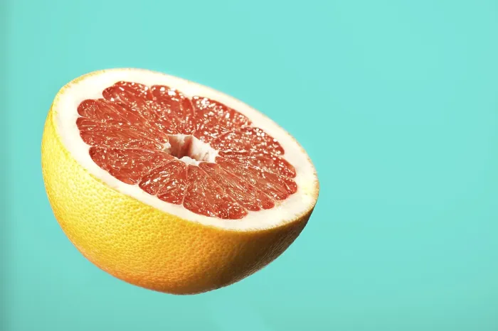 Gerahmter Druck : Rosafarne Grapefruit, halbiert. Gerahmter Druck : Rosafarne Grapefruit, halbiert.