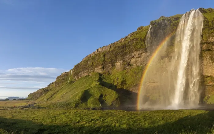 Gerahmter Druck : Regenbogen am Wasserfall von Seljalandsfoss Gerahmter Druck : Regenbogen am Wasserfall von Seljalandsfoss