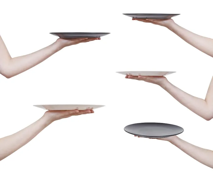 Gerahmter Druck : Satz aus flachen Platten in der Hand, gegen weißen Hintergrund. Gerahmter Druck : Satz aus flachen Platten in der Hand, gegen weißen Hintergrund.