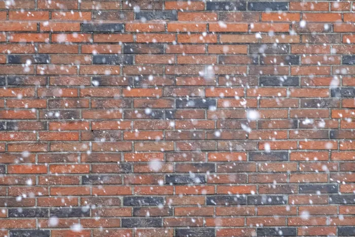 Gerahmter Druck : Schneeflocken vor einem Ziegelmauer. Gerahmter Druck : Schneeflocken vor einem Ziegelmauer.