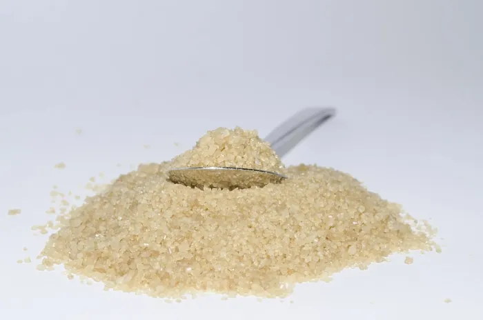Gerahmter Druck : Löffel mit braunem Zucker Gerahmter Druck : Löffel mit braunem Zucker