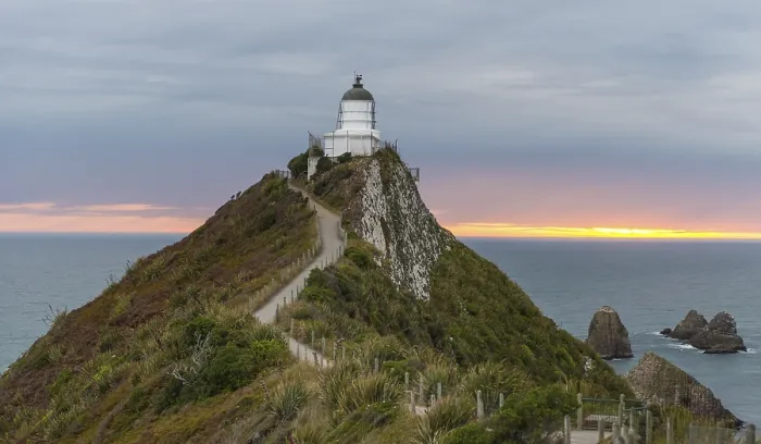 Gerahmter Druck : Sonnenaufgang, Leuchtturm am Nugget Point. Gerahmter Druck : Sonnenaufgang, Leuchtturm am Nugget Point.