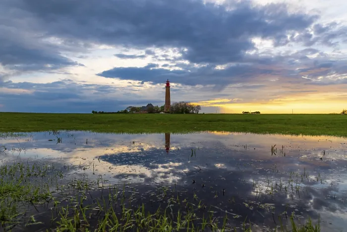 Gerahmter Druck : Sonnenuntergangsreflexion am Leuchtturm Flugge. Gerahmter Druck : Sonnenuntergangsreflexion am Leuchtturm Flugge.