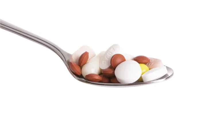 Gerahmter Druck : Tabletten auf einer Löffel. Gerahmter Druck : Tabletten auf einer Löffel.