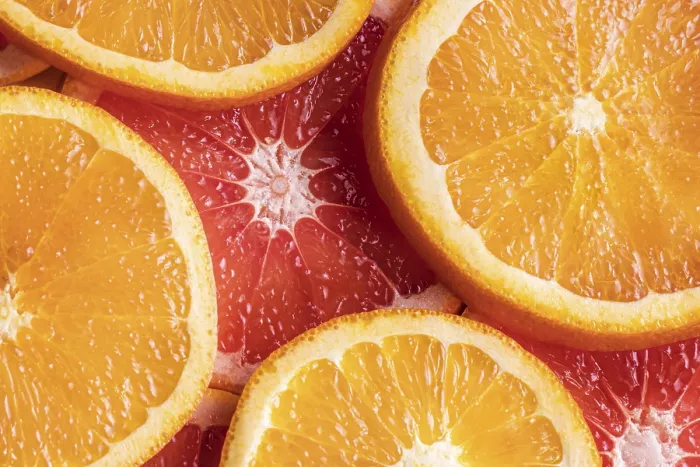 Gerahmter Druck : Obenansicht orangefarbene Grapefruchtstücke Gerahmter Druck : Obenansicht orangefarbene Grapefruchtstücke