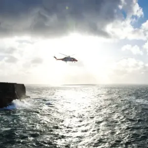 Beyond the dramatic limestone cliffs of the Aran Islands, Irish Coast Guard helicopter Rescue 115 and Severn class David Kirkaldy patrol the heaving Atlantic waters at the entrance to Galway Bay Beyond the dramatic limestone cliffs of the Aran Islands, Irish Coast Guard helicopter Rescue 115 and Severn class David Kirkaldy patrol the heaving Atlantic waters at the entrance to Galway Bay