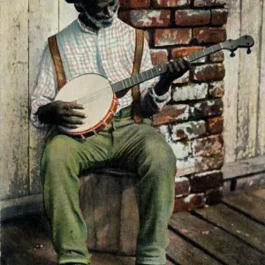 Uomo anziano nero suonando il banjo Uomo anziano nero suonando il banjo