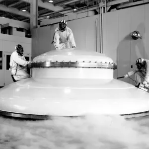 Technicians Exiting a Vacuum Tank Print Technicians Exiting a Vacuum Tank Print