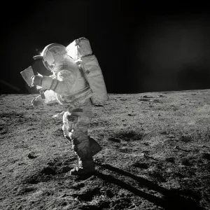 Apollo 14 astronaut Edgar D. Mitchell on the Moon, studying a map Apollo 14 astronaut Edgar D. Mitchell on the Moon, studying a map
