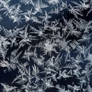 Print of a window with frost pattern atop the Zugspitze mountain Print of a window with frost pattern atop the Zugspitze mountain