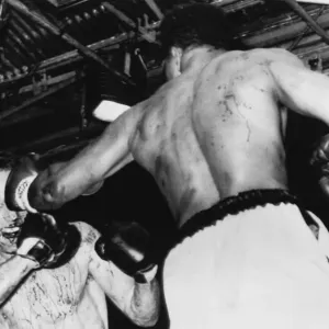 Print of Henry Cooper and Muhammad Ali in 1966 heavyweight title fight Print of Henry Cooper and Muhammad Ali in 1966 heavyweight title fight