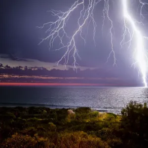 Lightning Strikes Print: Sunset Ocean Scene Lightning Strikes Print: Sunset Ocean Scene
