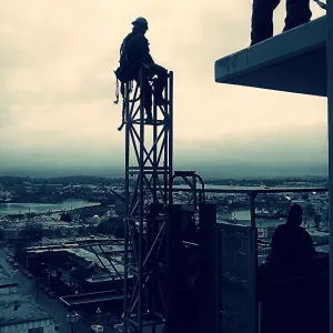Construction Worker At Rest High Up In The Air