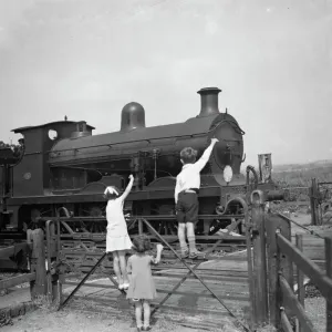 1936 Print: Children Waving to Train Driver