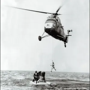 Print of John Glenn being evacuated from Friendship 7 by helicopter Print of John Glenn being evacuated from Friendship 7 by helicopter