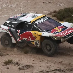 Print of Peugeot's Stephane Peterhansel and Jean Paul Cottret in action Print of Peugeot's Stephane Peterhansel and Jean Paul Cottret in action