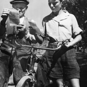 Black and white print of two Sicilians reading leaflets Black and white print of two Sicilians reading leaflets