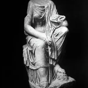 Fragmented statue representing the Goddess Iside. Etruscan archaeological find preserved in the Archaelogical Museum of Fiesole Fragmented statue representing the Goddess Iside. Etruscan archaeological find preserved in the Archaelogical Museum of Fiesole