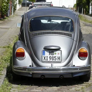 Silver VW Beetle parked on the street