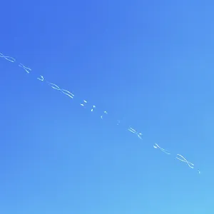 Contrails Form Patterns in Blue Sky Print Contrails Form Patterns in Blue Sky Print