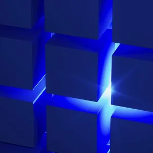 Estructuras cúbicas crean un atractivo arreglo geométrico destacado por la luz azul.