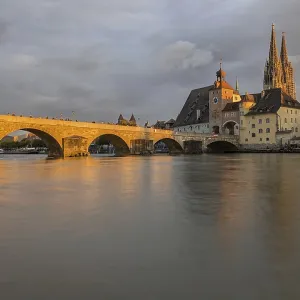 Regensburg, Germany: Serene Riverside Print at Sunset Regensburg, Germany: Serene Riverside Print at Sunset