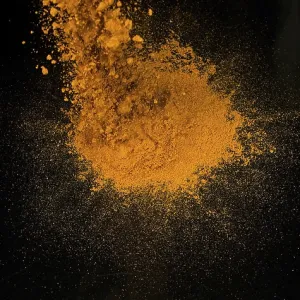 Turmeric Print: Exploding Powder against Black Background Turmeric Print: Exploding Powder against Black Background