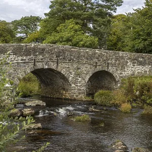 Two-arched stone bridge Print over Dartmoor River