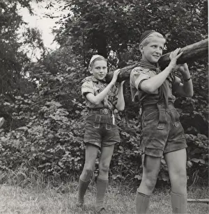 Historical Boy Scout Images Drucke: Two Austrian boy scouts lifting a pole