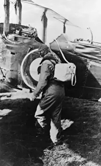 Royal Air Force Pilot Drucke: British pilot getting into his plane, WW1