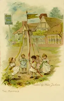 Kinder tanzen um den Maibaum