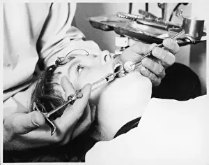 Dental Hygiene Practices Drucke: Dentist with Patient