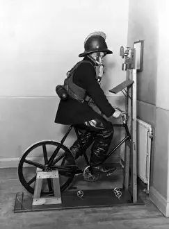 Historical Firefighting Images Drucke: Firefighter undergoing ergometer test