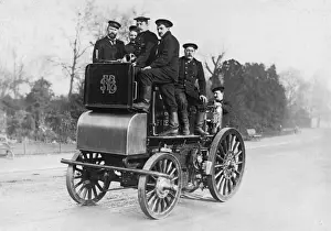 Early Firefighting Equipment Drucke: Firemen riding a fire engine